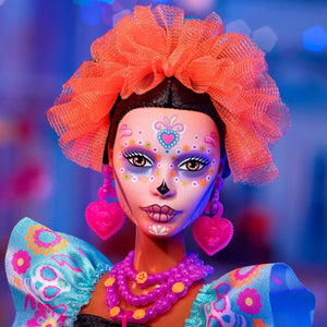 Close-up of Barbie Día de Muertos 2024 doll featuring detailed sugar skull face paint and orange floral headpiece.