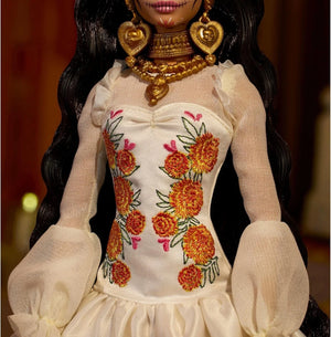 Detailed view of Barbie Día de Muertos 2025 doll bodice with marigold floral embroidery