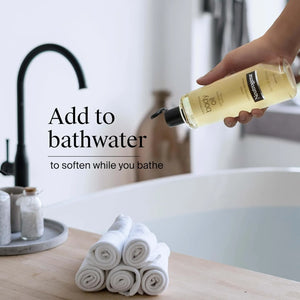 Neutrogena Body Oil Light Sesame Formula being poured into bathwater.