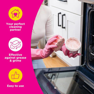 Applying Stardrops The Pink Stuff cleaning paste with sponge to clean oven surface and remove grease.