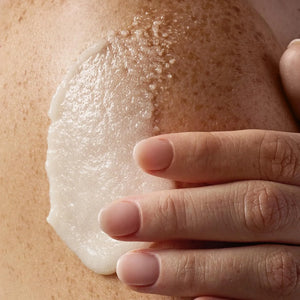 Tree Hut Vanilla Shea Sugar Scrub applied on skin showing exfoliating and moisturizing body treatment.