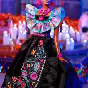 Detailed view of Barbie Día de Muertos 2024 black dress with colorful embroidered sugar skull and floral patterns.