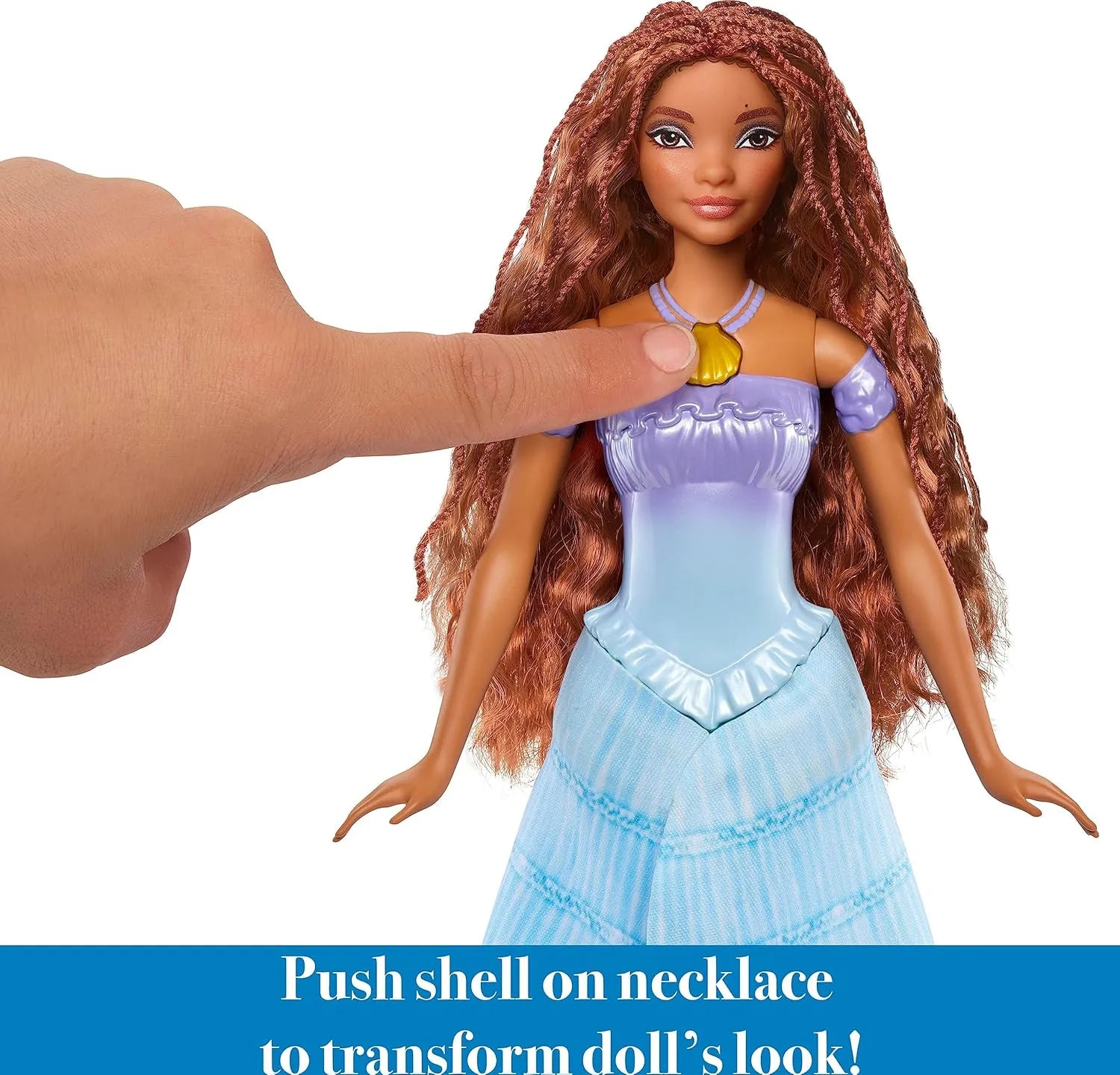 Close-up of Ariel doll shell necklace button used to transform her look.