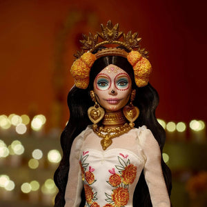 Barbie Día de Muertos 2025 doll with calavera face paint, gold jewelry, and marigold flower crown