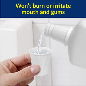 Hand pouring liquid from a bottle into a small container with text about mouth and gums.