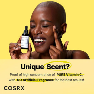 Model holding COSRX Vitamin C 23% serum demonstrating brightening skincare routine