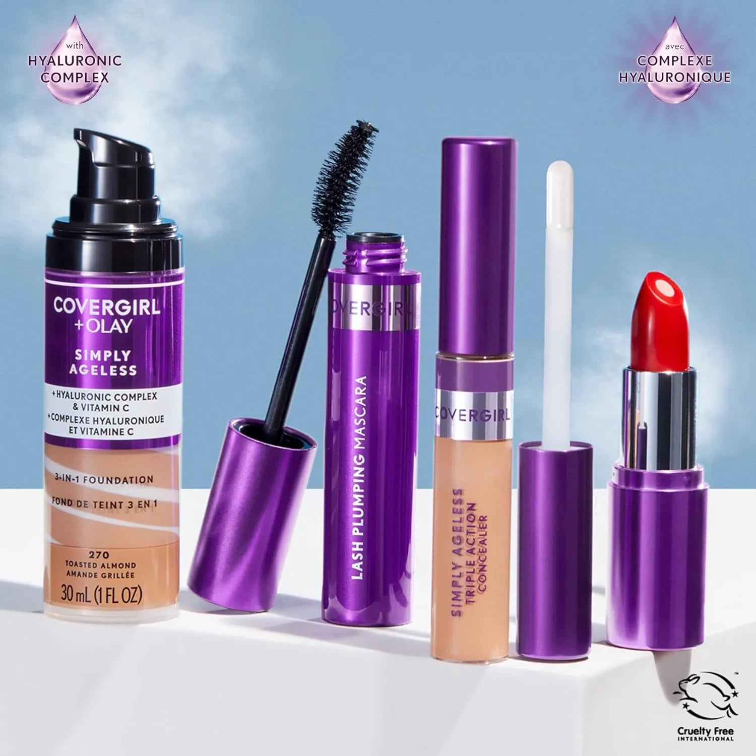 Makeup products including a foundation, mascara, concealer, and lipstick with purple accents on a light blue background.