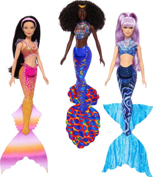 Three Ariel Sisters mermaid dolls from Disney The Little Mermaid set showing vibrant tails, detailed tops, and styled hair.