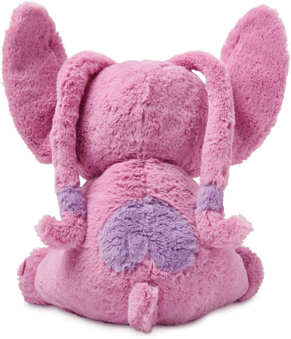 Back view of Disney Store Angel medium soft toy showing fuzzy pink plush texture, floppy ears, and embroidered wing details.