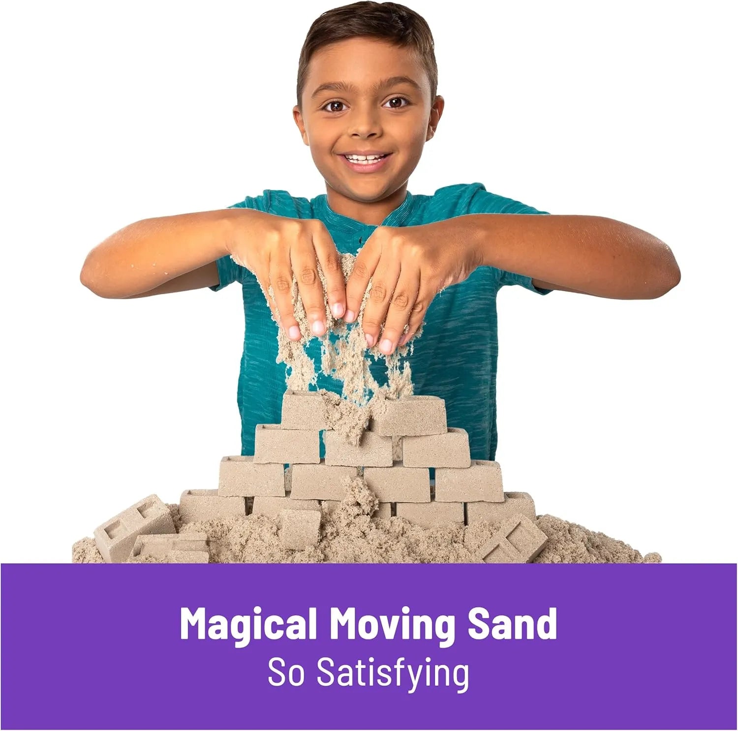 Boy playing with Kinetic Sand construction set building sand bricks, magical moving sand sensory toy for kids age 3 and up.
