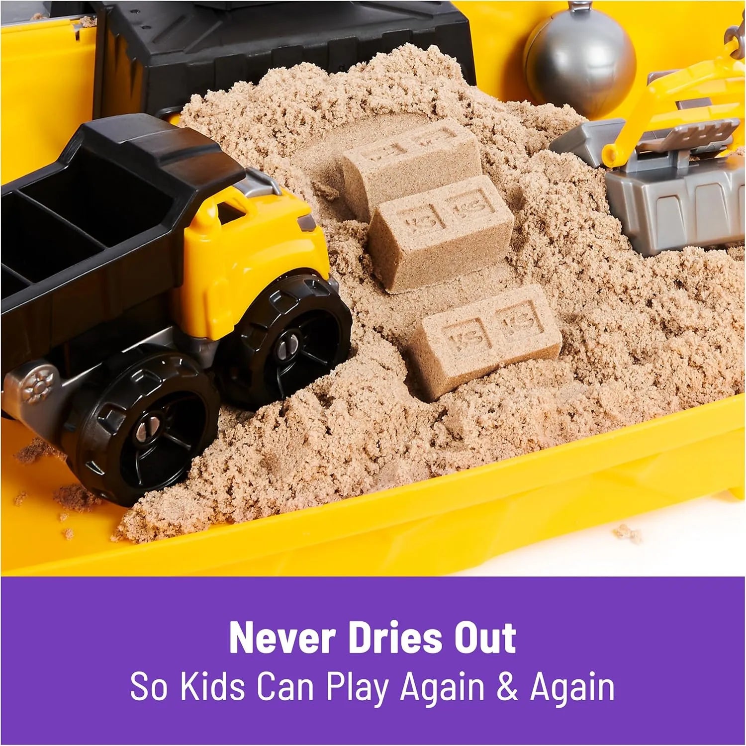 Close-up of Kinetic Sand construction site sandbox with toy dump truck and sand bricks, 2lbs indoor sensory play sand set.