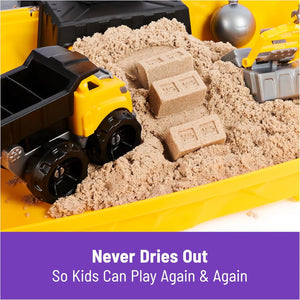 Close-up of Kinetic Sand construction site sandbox with toy dump truck and sand bricks, 2lbs indoor sensory play sand set.