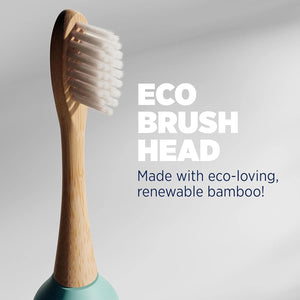 Close-up of bamboo toothbrush head with soft white bristles