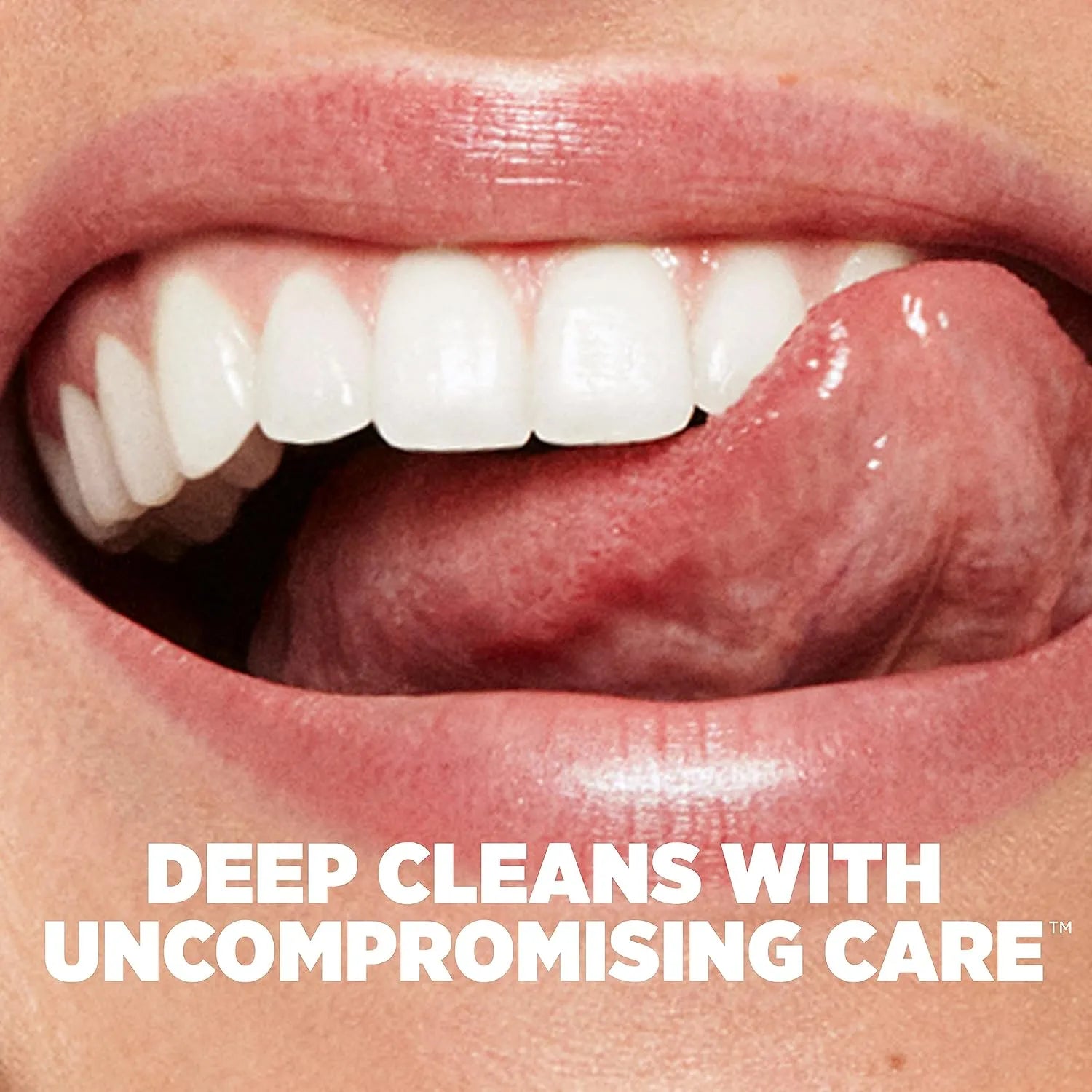 Close-up of smiling mouth with white teeth and text about deep cleaning care