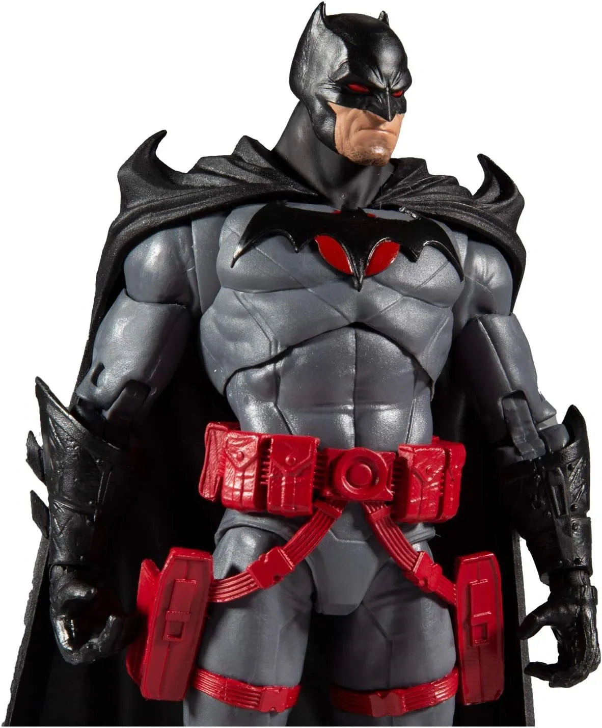 Close-up of McFarlane DC Batman Flashpoint 7-inch action figure showing chest emblem and red utility belt details.