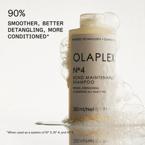 Olaplex No.4 Bond Maintenance Shampoo 250ml bottle with foam detail.