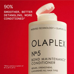 Olaplex No.5 Bond Maintenance Conditioner bottle with flip cap open.