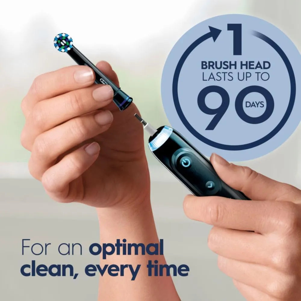 Close-up of Oral-B Genius X electric toothbrush with removable brush head and 90 day usage graphic.