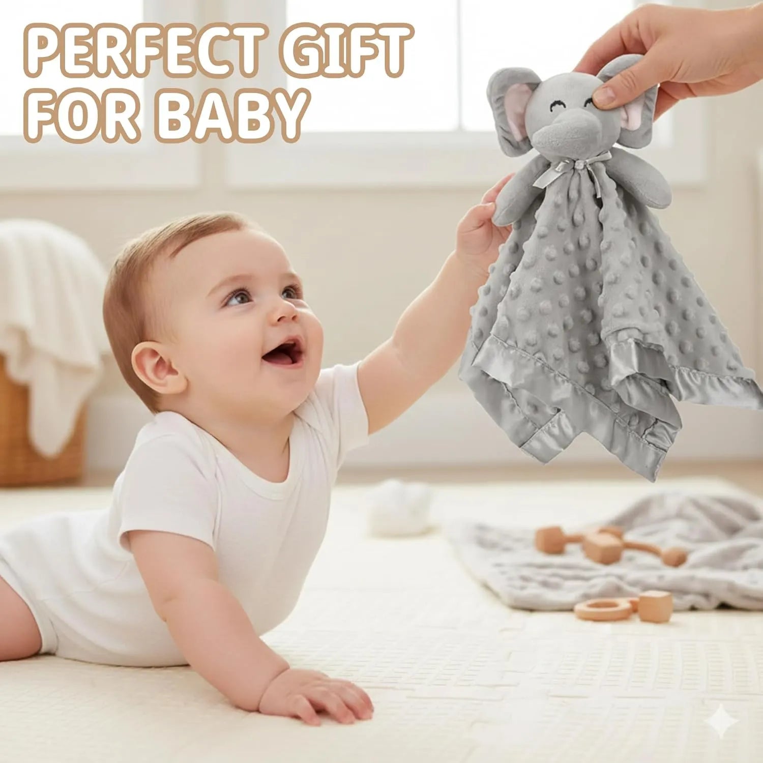 Baby reaching for Pro Goleem grey elephant security blanket lovey