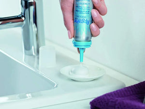 Rogaine Women’s 5% Foam dispensed onto a surface showing lightweight foam texture