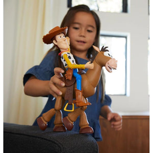 Child playing with Woody and Bullseye Toy Story 4 figures for imaginative storytelling play.